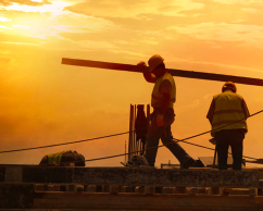 ERISA law teaser image showing construction site workers at dusk