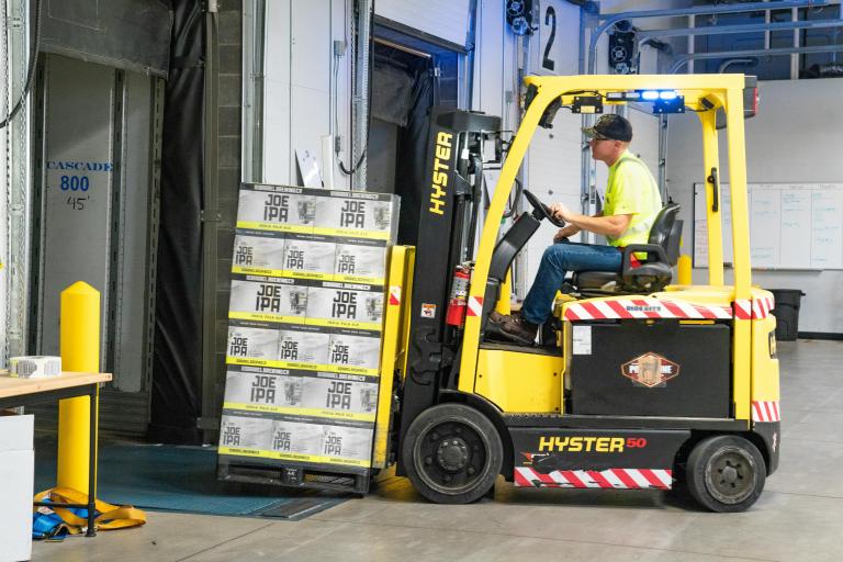 Man driving forklift